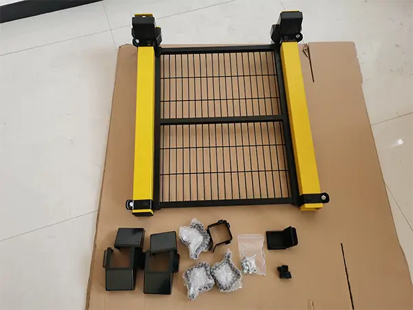 Installation accessories of the machine guarding system are placed on a cardboard box.