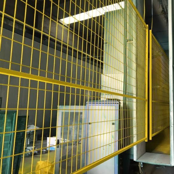 Mesh panel after powder coating is hanging in the air for natural drying.