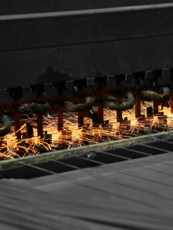 The machine is producing weld-mesh panels.
